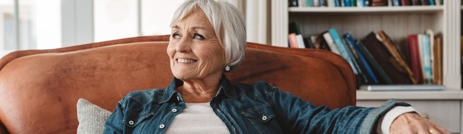 mature woman sitting in chair smiling