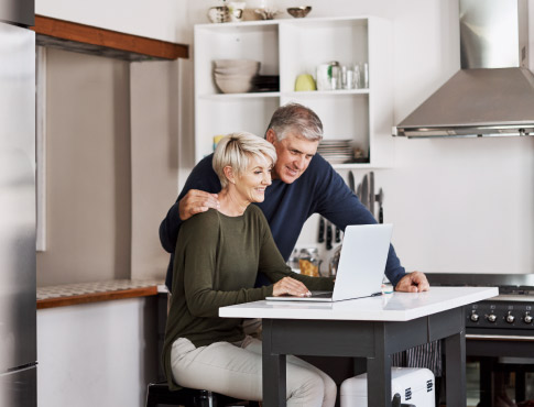 Couple looking at laptop together