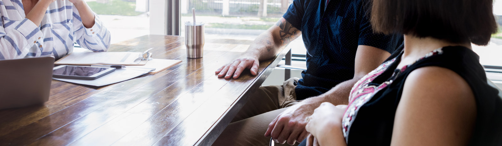 people sitting around table talking